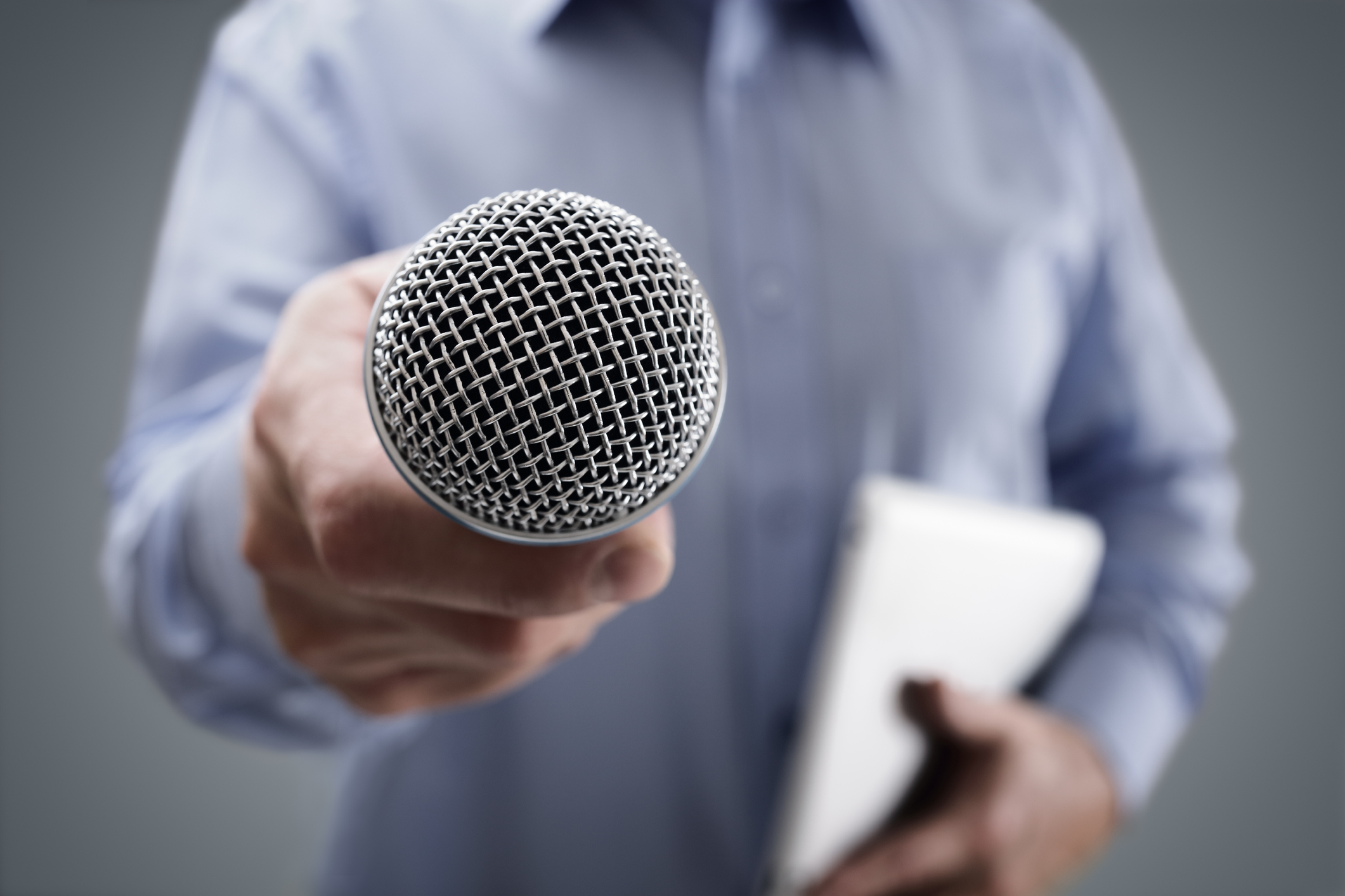 Person holding microphone