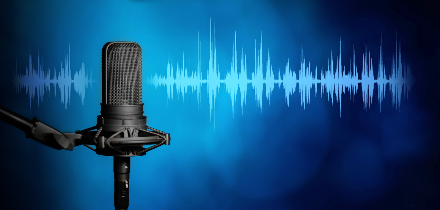 Black podcasting microphone on a blue background with soundwaves